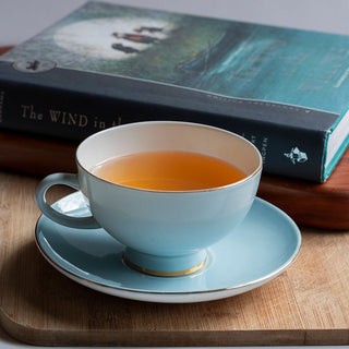 Darjeeling First Flush black tea with teacup and book