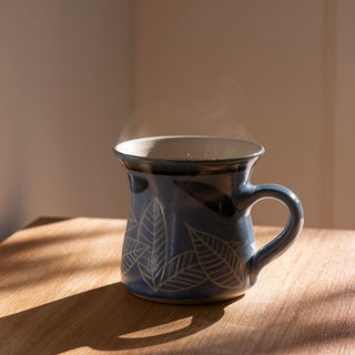 Assam black tea and tea cup