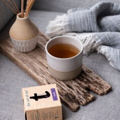 Vanilla black tea with cup and tea box